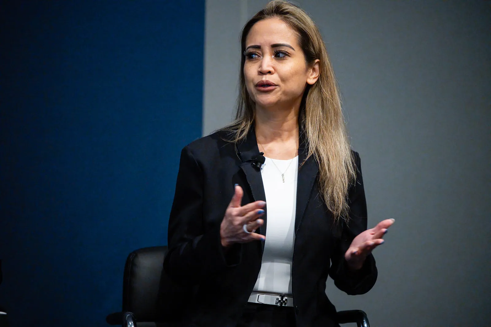 Monica Cutia speaking on stage at the Arrowfly FUTURE conference