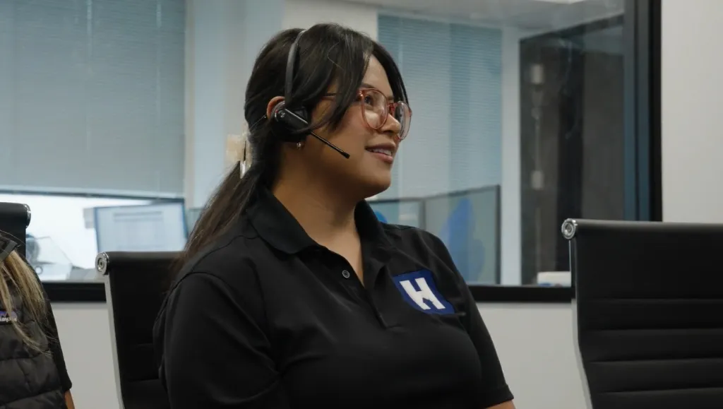 A HealthView team member on a call at the office